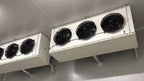 Two air conditioning units mounted on a ceiling
